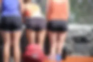 Tourist friends backpacking in shorts with vpl