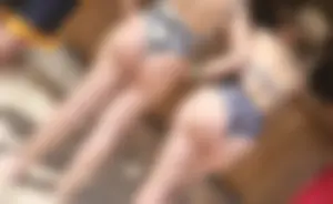 Milf in bikini with her friend at the beach bar
