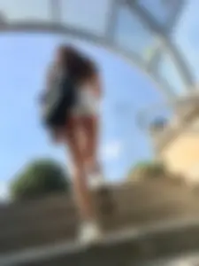 Cute candid girl with glasses in white shorts showing cheeks