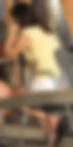 Lady in flop flops while eating showing her feet
