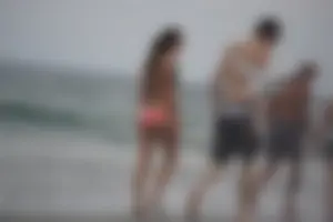 Peach bikini tattood babe on the beach with a nice ass and some camel toe