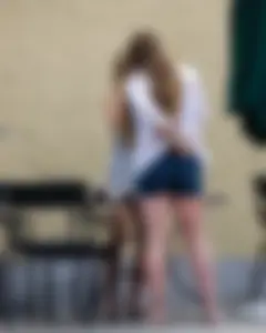Sexy girl in a tiny grey skirt with decent ass