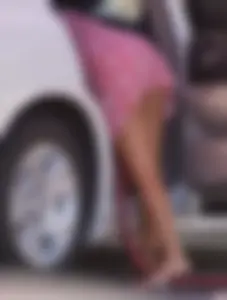 Sexy blonde upskirted in pink dress while cleaning her car