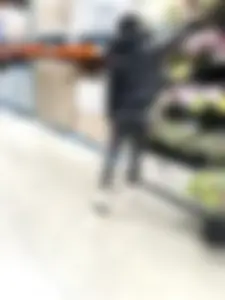 Girl in leggings with a perfect ass and slim legs picking flowers at the supermarket creepshots