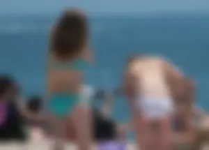 Bunch of sexy babes at the beach in bikinis