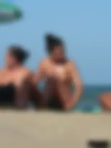Bunch of sexy babes on the beach topless and in thong bikinis
