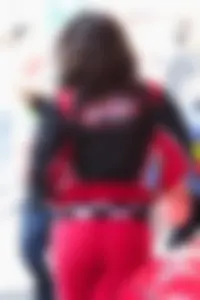 Beautiful and sexy Toyota car girl in red leggings
