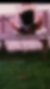 Girl Squat Cross-Legged on a Bench Candid