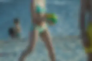 Girl in Green Swimsuit with Hot Body Playing Volleyball on the Beach Candid Gallery