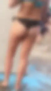 Beach shower milf in semi thong bikini with a nice ass