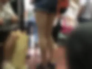 Girl in Shorts Standing in a Subway Train With Spread Legs - Creepshots Gallery