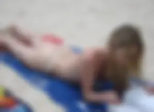 Micro thong blonde on the beach with pokies and camel toe
