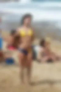 Sexy Corona girl in bikini on the beach