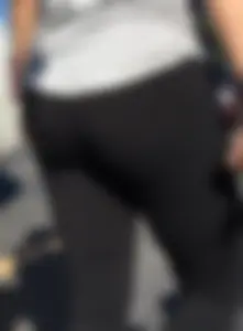Blonde with a sexy round ass in tight leggings walking