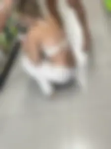 Blonde college girl squatting deep in supermarket, visible thong!