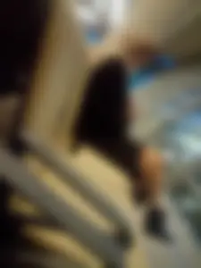 Blonde Sitting With Crossed Legs at the Station