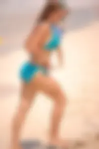 Assortment of sexy babes at the beach in bikinis