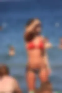 A couple sexy girls laying out on the beach