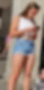 Sexy And Young Candid Girl in a Top And Denim Shorts Standing on the Street, Smoking Hot Legs Creepshot