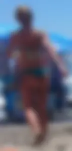 Sexy blonde on the beach in a teal thong bikini with nice ass