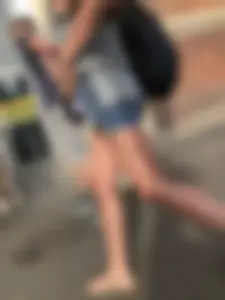 Girl in Denim Mini Shorts and Sandals With Sexy Legs And Feet Street and Subway Photos