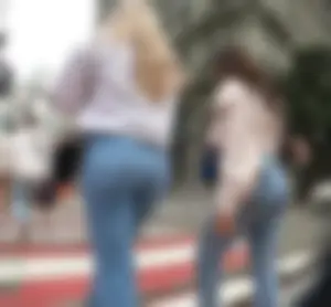 Candid blonde and brunette duo with nice asses out in blue jeans