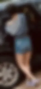 Hottie wearing denim shorts by the car creepshot