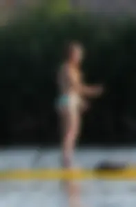 Rowing girl in a bikini with a nice ass