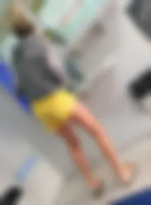 Skinny ass eating her yellow shorts
