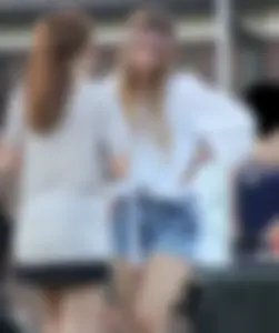 Hippie type dressed girl in denim shorts with a nice ass