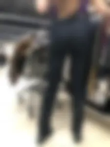 Cute candid shop assistant wearing boots and tight pants