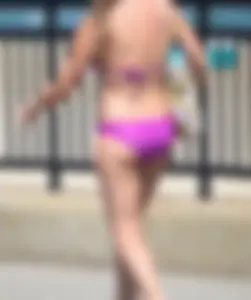 Sexy thick blonde girl in purple bikini