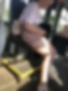 Young Girl in Sandals and Shorts in a Public Bus