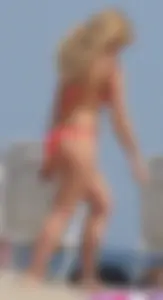 Sexy thick blonde girl with tiny bikini and big booty on the beach