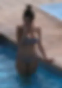 Sexy pool teen with big boobs barely staying in her top