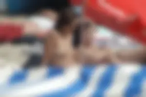 Girls on a nude beach in Sitges, Spain