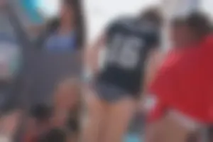 A group of teens in bikinis on the beach