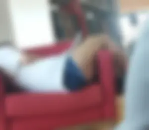 Candid Girl in Mini Shorts Curled Up in the Couch at the Library