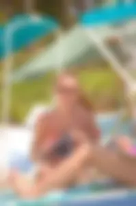 Bunch of sexy girls and milfs in bikinis at the beach