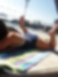 Sexy brunette teen in blue swimsuit by the pool