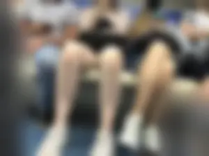 Tall Girl in Denim Mini Shorts and Sneakers With Long Pale Legs in a Subway Train
