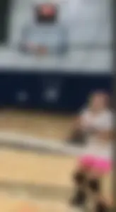 Bunch of cute college girls in bright pink shorts playing volleyball