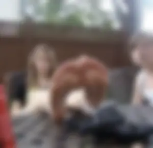 Teen JB Sitting with her Bare Legs on Garden Table