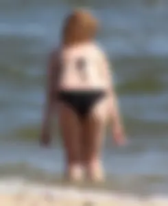 Two sexy beach teens in bikinis, one thick and one skinny with big boobs