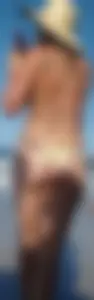 Cute girl on the beach with a decent body in thong bikini