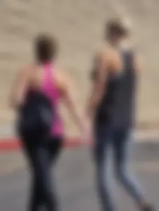 Skinny blonde in grey leggings with a friend