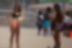 Beach volleyball babe with a nice ass in pink bikini bottom