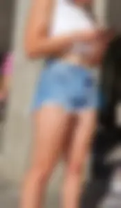 Sexy And Young Candid Girl in a Top And Denim Shorts Standing on the Street, Smoking Hot Legs Creepshot