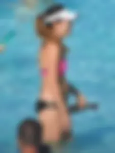 Asian milf in black and pink bikini at the beach