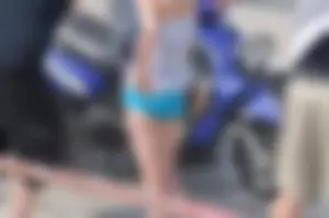 Skinny babe with a cute little ass in tiny blue shorts